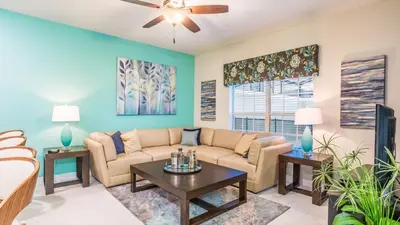 a living room with a couch and a table at 4805 Brier Rose in Kissimmee