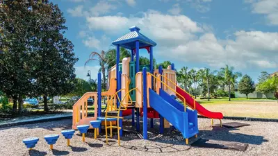 a playground with a slide in a park at 2979 Buccaneer Palm in Kissimmee