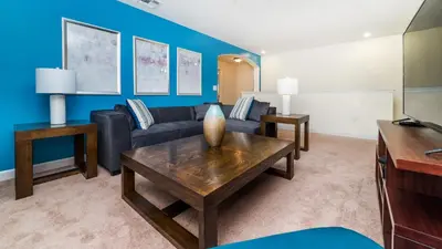 a living room with a couch and a table at 2979 Buccaneer Palm in Kissimmee