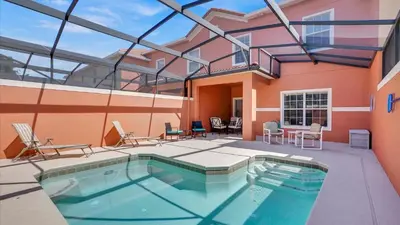 a swimming pool in the middle of a house at 8959 California Palm in Kissimmee