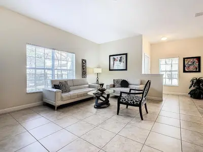 a living room with a couch and a table at 8967 California Palm in Kissimmee