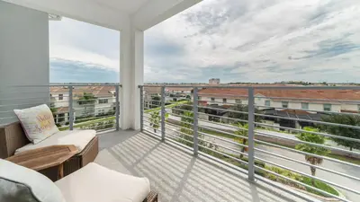 a balcony with a view of a city at 4751 Clock Tower #401 in Kissimmee
