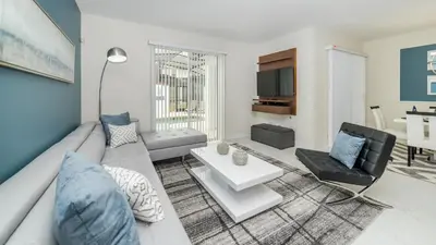 a living room with a couch and a table at 3076 Juliet in Kissimmee
