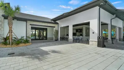a house with a patio with a palm tree at 4169 Paragraph in Kissimmee