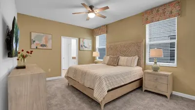 a bedroom with a bed and a ceiling fan at 4169 Paragraph in Kissimmee