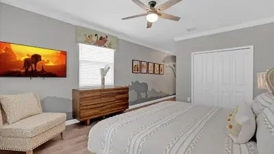 a bedroom with a bed and a ceiling fan at 4277 Prologue in Kissimmee