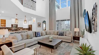 a living room with a couch and a table at 4277 Prologue in Kissimmee