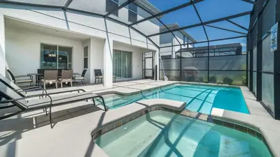a house with a swimming pool and a patio at 4720 Sleepy Hollow in Kissimmee