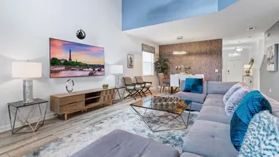 a living room with a couch and a table at 4724 Sleepy Hollow in Kissimmee