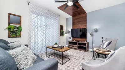 a living room with a couch and a tv at 4951 Windermere in Kissimmee
