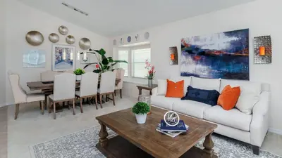 a living room with a white couch and a table at 2787 Lido Key in Kissimmee
