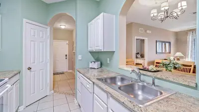 a kitchen with a sink and a counter top at 7654 Comrow #403 in Kissimmee