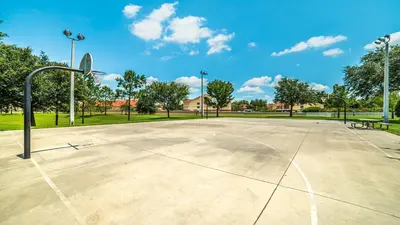 an empty basketball court in a park at 7660 Comrow #303 in Kissimmee