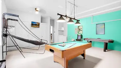a room with a ping pong table and a net at 7705 Comrow in Kissimmee