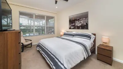 a bedroom with a bed and a flat screen tv at 7705 Comrow in Kissimmee
