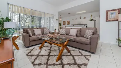 a living room with a couch and a table at 7730 Comrow in Kissimmee