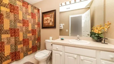 a bathroom with a toilet and a sink at 7740 Comrow in Kissimmee