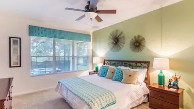 a bedroom with a bed and a ceiling fan at 2633 Daulby in Kissimmee