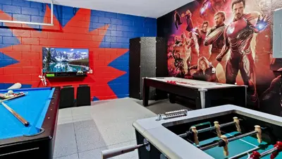 a gaming room with a pool table and a tv at 2644 Daulby in Kissimmee