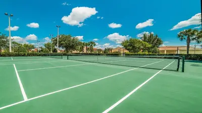 a tennis court with two tennis courts at 2644 Daulby in Kissimmee