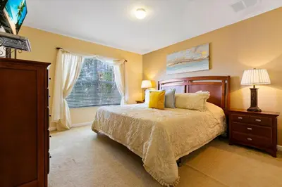 a bedroom with a bed and a window at 2678 Manesty in Kissimmee
