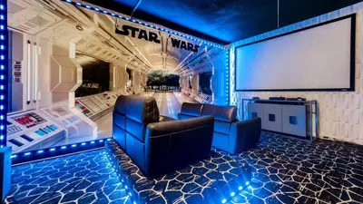 a star wars room with two chairs and a giant screen at 2696 Manesty in Kissimmee