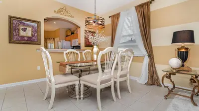 a dining room with a table and chairs at 2696 Manesty in Kissimmee