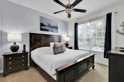 a bedroom with a bed and a ceiling fan at 2702 Manesty in Kissimmee