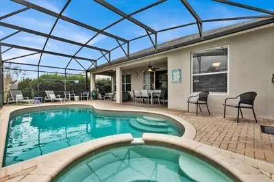 an indoor swimming pool with a glass roof at 2702 Manesty in Kissimmee