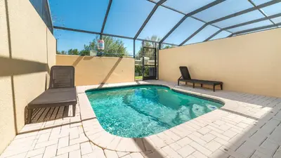 a swimming pool in a building with a glass roof at 2537 Maneshaw in Kissimmee