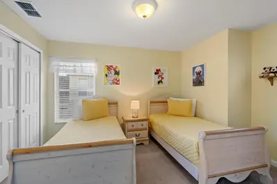 a bedroom with two beds and a window at 2605 Pawnall in Kissimmee