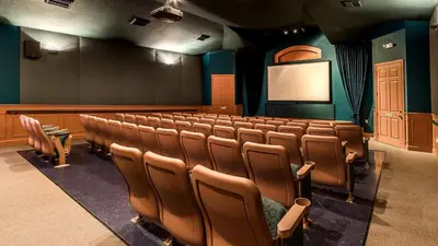 an empty lecture room with chairs and a screen at 8008 King Palm in Kissimmee