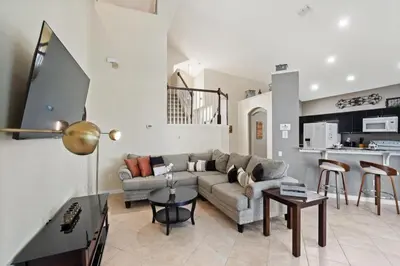 a living room with a couch and a table at 8038 King Palm in Kissimmee