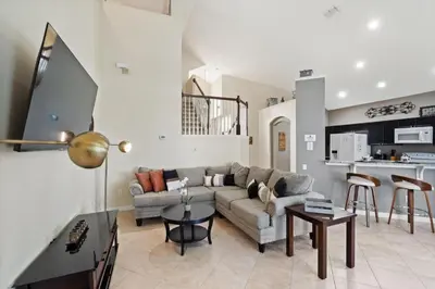 a living room with a couch and a table at 8038 King Palm in Kissimmee