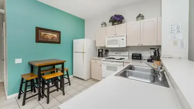 a kitchen with a sink and a counter top at 8114 Princess Palm in Kissimmee