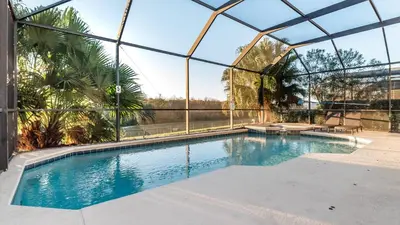a swimming pool inside of a glass house at 8135 Sun Palm in Kissimmee