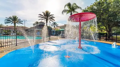 a fountain in the middle of a swimming pool at 8135 Sun Palm in Kissimmee