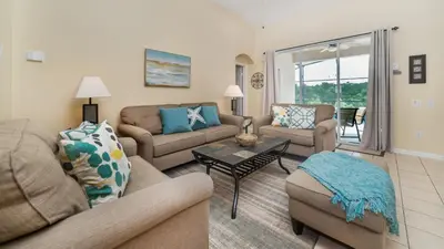 a living room with a couch and a table at 8137 Sun Palm in Kissimmee