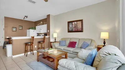 a living room with a couch and a table at 2326 Silver Palm in Kissimmee
