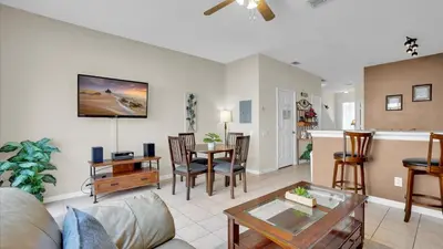 a living room with a couch and a table at 2326 Silver Palm in Kissimmee