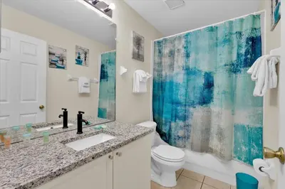 a bathroom with a sink and a toilet at 2244 Wyndham Palms in Kissimmee