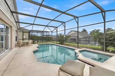 an indoor swimming pool with a glass roof at 2244 Wyndham Palms in Kissimmee