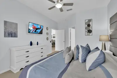 a bedroom with a bed and a ceiling fan at 2244 Wyndham Palms in Kissimmee