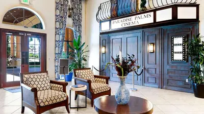a lobby with chairs and a vase on a table at 8968 Cuban Palm in Kissimmee