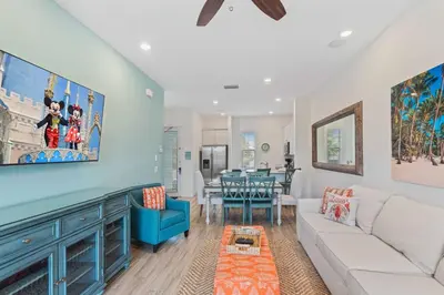 a living room with a couch and a table at 8000 Lost Shaker Lane in Orlando
