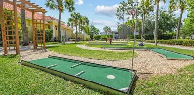 a golf course with two putting greens in a park at 201 Hideaway beach 4 beds - pool&spa in Kissimmee