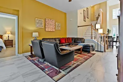 a living room with a couch and a table at 2638 Dinville in Orlando