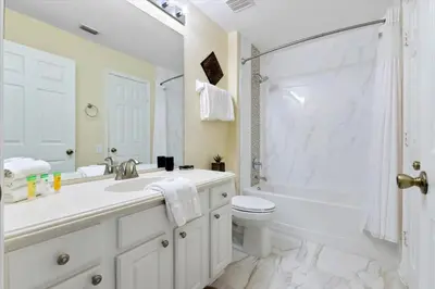 a bathroom with a sink and a toilet and a shower at 2638 Dinville in Orlando
