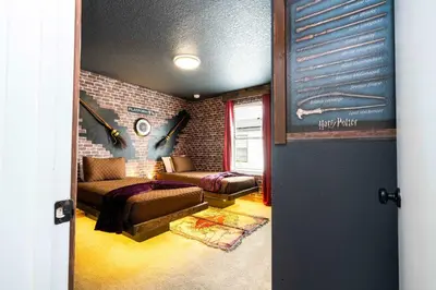 a living room with a couch and a brick wall at Marvelous 3Bd Close to Disney w GameRoom at The Hub 3409 in Kissimmee