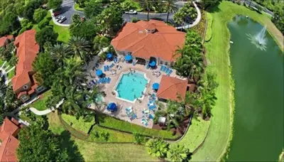 an aerial view of a house with a swimming pool at Be-Our-Guest Home! 15 mins to Disney! in Kissimmee